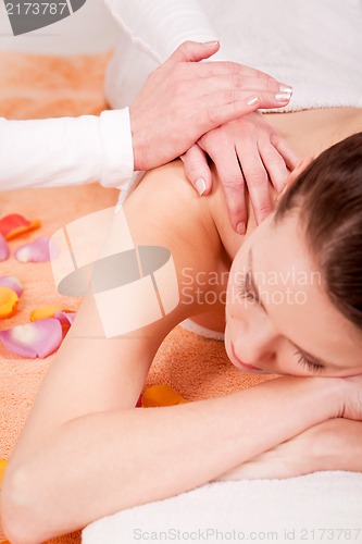 Image of young attractive smilig woman doing wellness spa