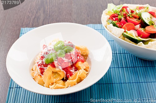 Image of tasty fresh homemade ravioli and tomato sauce