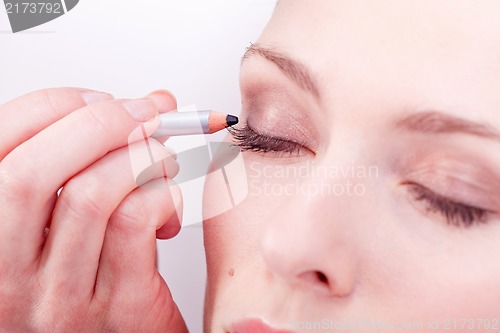 Image of at the cosmetic studio eyeliner on eyes make up