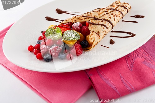 Image of fresh tasty homemade crepe pancake and fruits