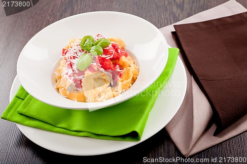 Image of tasty fresh homemade ravioli and tomato sauce