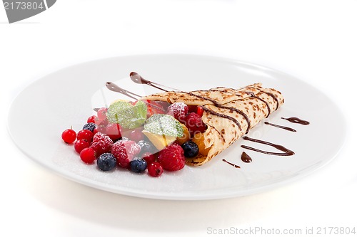 Image of fresh tasty homemade crepe pancake and fruits