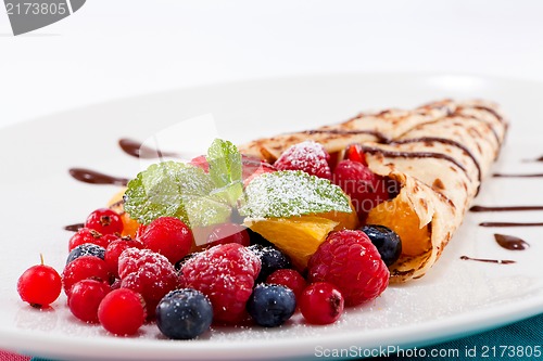 Image of fresh tasty homemade crepe pancake and fruits