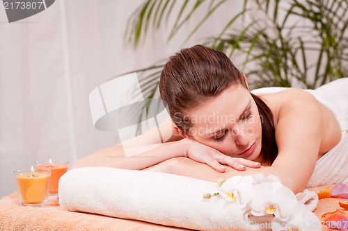 Image of young attractive smilig woman doing wellness spa