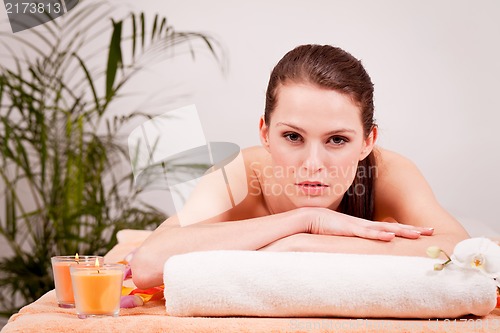 Image of young attractive smilig woman doing wellness spa