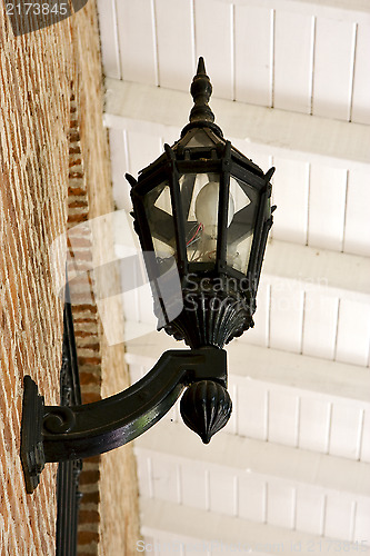 Image of  street lamp  and a brown brick 