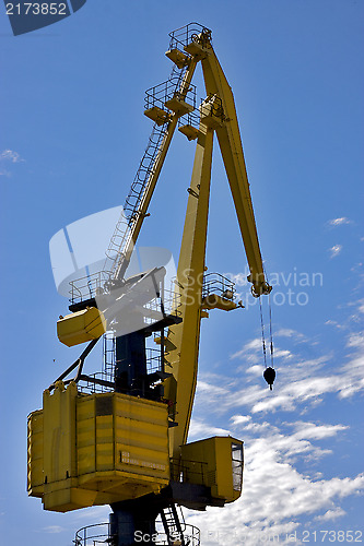 Image of sky clouds and yellow crane in   argentina