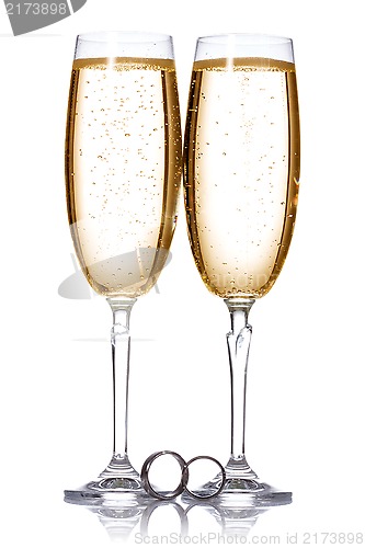 Image of Champagne and wedding rings