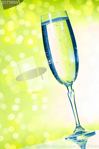 Image of Champagne glasses on the green background 