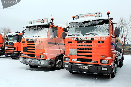 Image of Row of Orange Scania Trucks