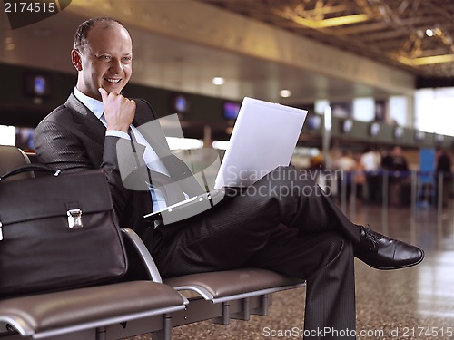 Image of businessman and airport