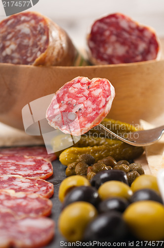 Image of cold cut platter with pita bread and pickles