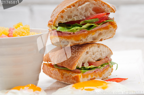 Image of ciabatta panini sandwich eggs tomato lettuce