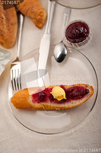 Image of bread butter and jam 