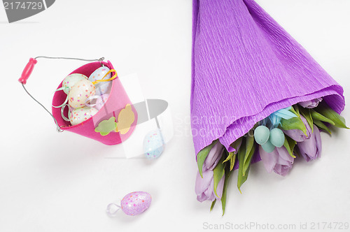 Image of Easter eggs with tulips and bucket