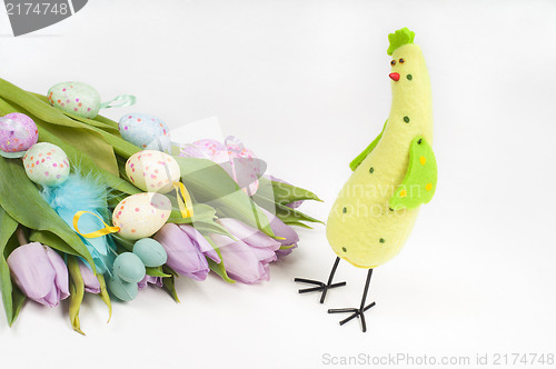 Image of Easter chicken with tulips and eggs