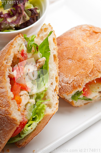 Image of ciabatta panini sandwich with chicken and tomato