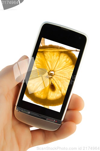 Image of Mobile phone with lemon splash