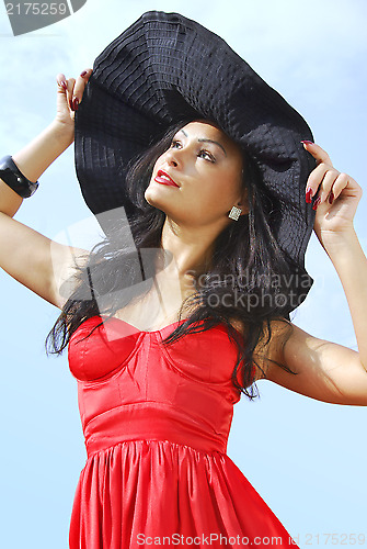 Image of woman in a black hat