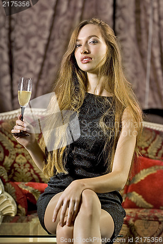 Image of woman with glass of brut