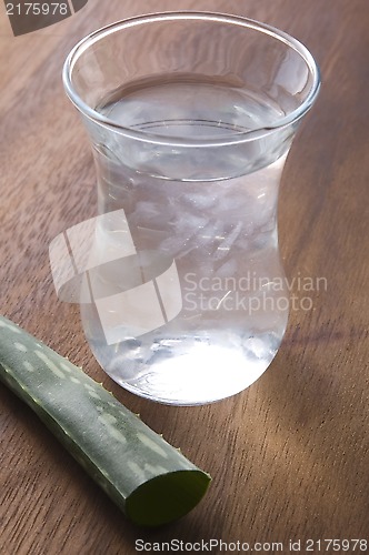 Image of aloe vera juice with fresh leaves