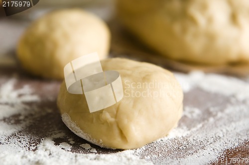 Image of Dough on wooden board