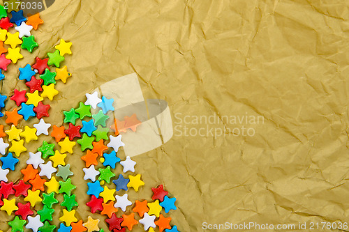 Image of Multicolored stars on a background of crumpled paper