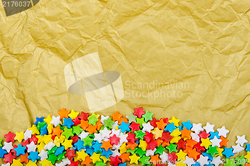 Image of Multicolored stars on a background of crumpled paper