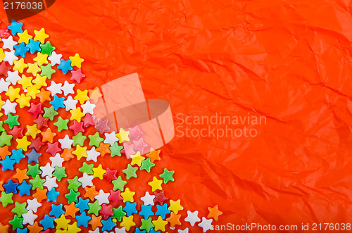 Image of Multicolored stars on a background of crumpled paper