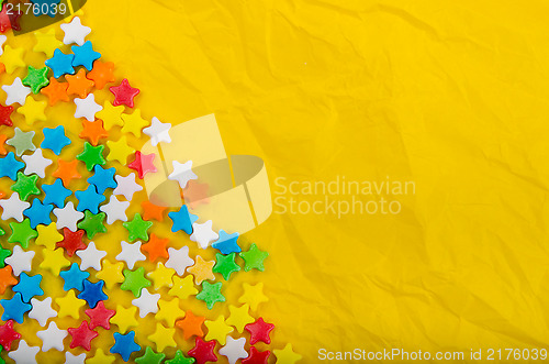 Image of Multicolored stars on a background of crumpled paper