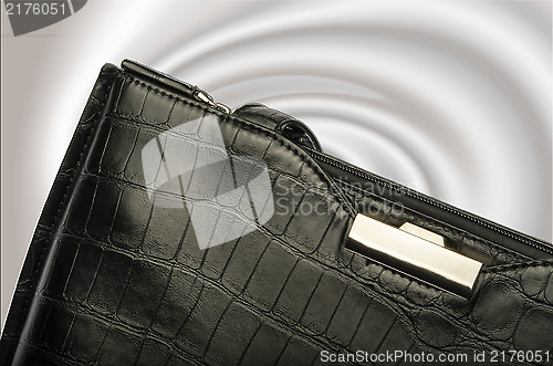 Image of A black business handbag isolated on a graduated background
