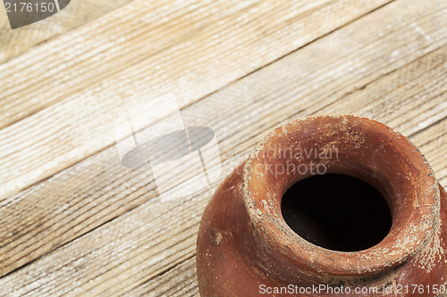 Image of grunge red clay pot