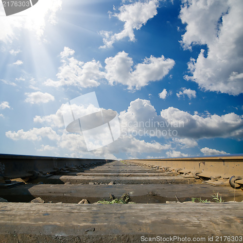 Image of railroad under dramatic sky