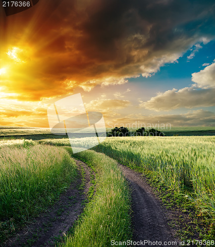 Image of dramatic sunset over road to horizon