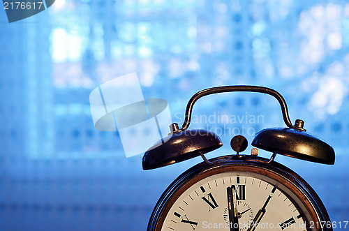 Image of old-fashioned copper alarm clock  