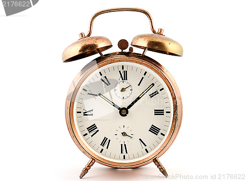 Image of old-fashioned vintage copper alarm clock  