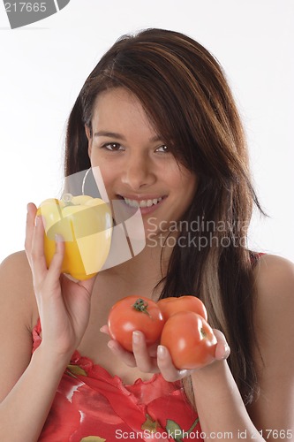 Image of Woman holding chili peppers