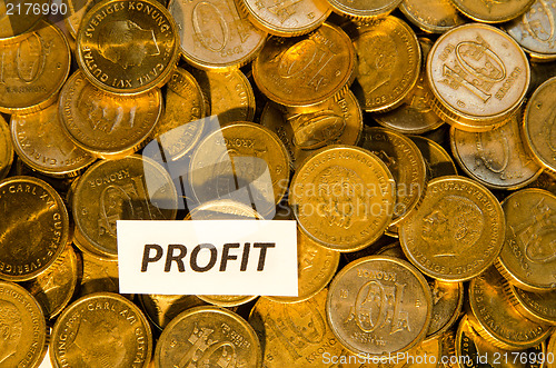 Image of Profit sign at a stack of golden coins