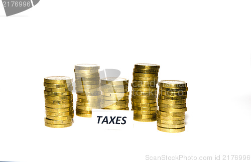 Image of Taxes sign at coin piles
