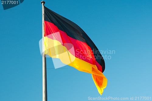 Image of German flag against blue sky