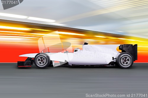 Image of formula one car on empty road