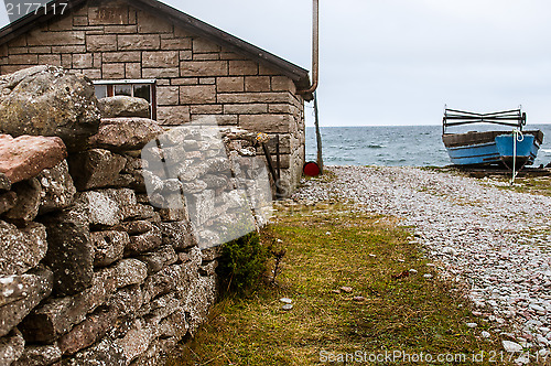 Image of Blue boat on shore