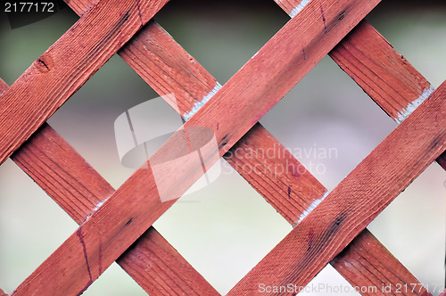 Image of red lattice fence detail