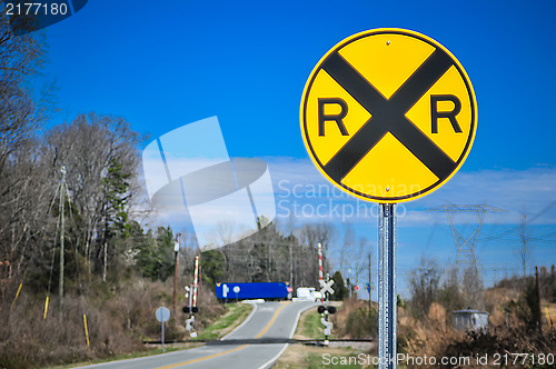 Image of yellow railroad tracks sign