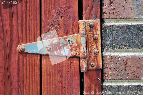 Image of old rusty door hinge