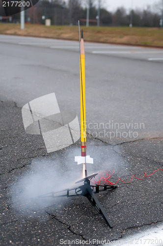 Image of model toy rocket lift off