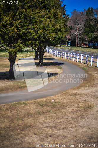 Image of country sidewalk with white fence