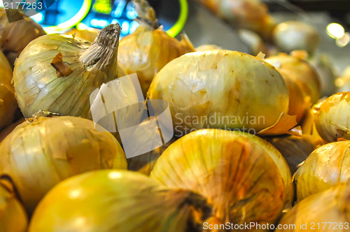 Image of onion heap on open market as background