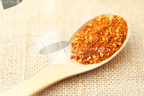 Image of Chili powder on wooden spoon