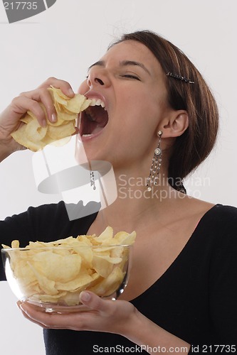 Image of Woman eating chips